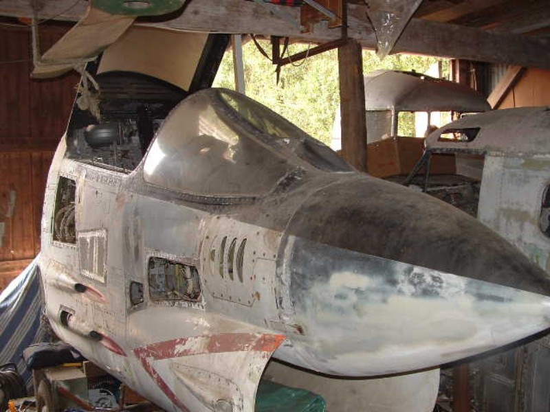 Situated next to a Beech 18 and a DC-3 cockpit. Situated next to a Beech 18 and a DC-3 cockpit.